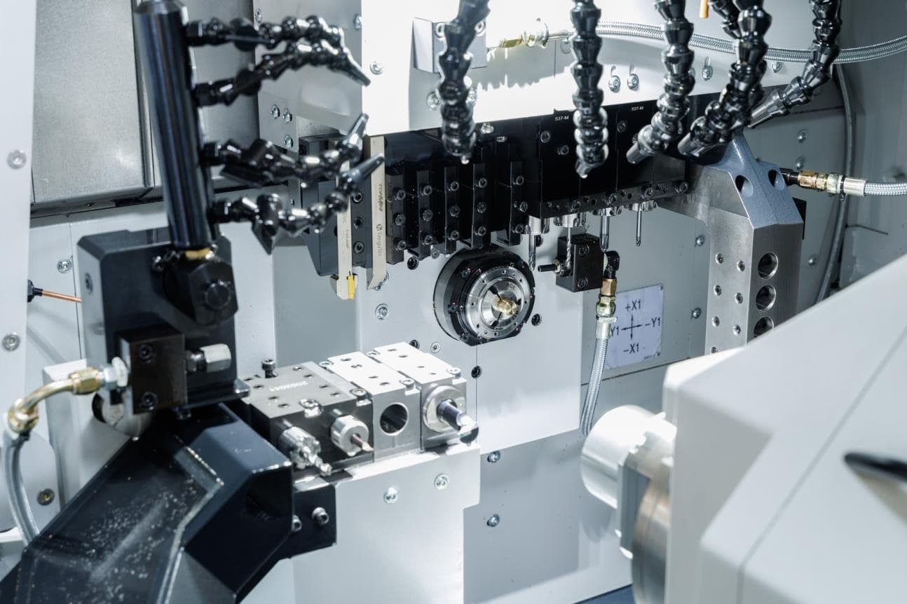 Multi-tool CNC sliding head work zone